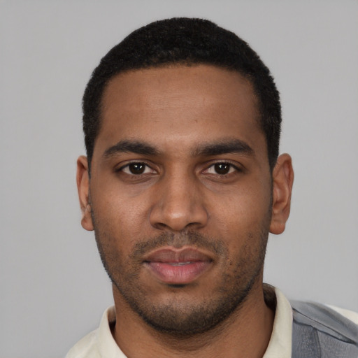 Neutral black young-adult male with short  black hair and brown eyes