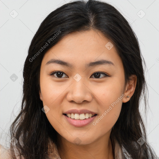 Joyful asian young-adult female with long  brown hair and brown eyes