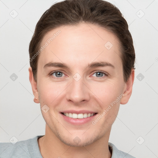 Joyful white young-adult female with short  brown hair and grey eyes