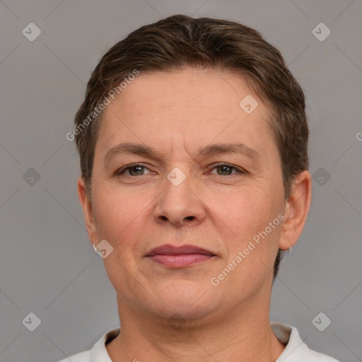 Joyful white adult female with short  brown hair and brown eyes