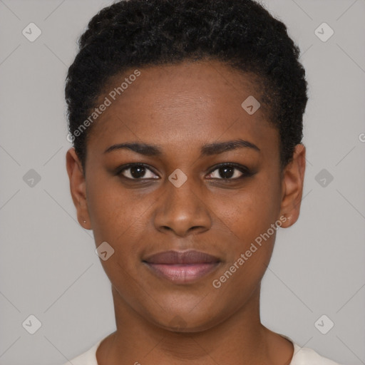 Joyful black young-adult female with short  brown hair and brown eyes