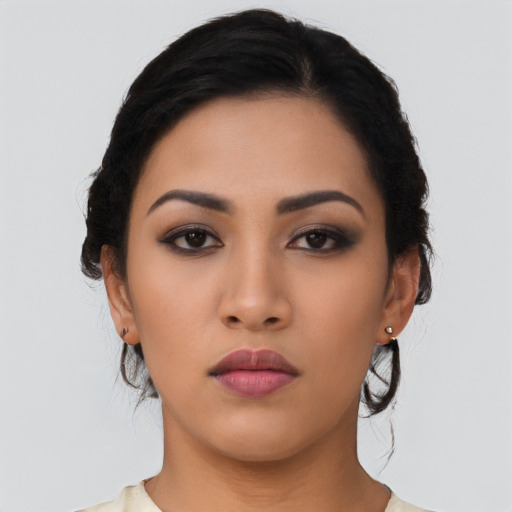 Neutral latino young-adult female with long  black hair and brown eyes