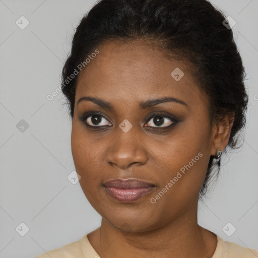 Joyful black young-adult female with medium  brown hair and brown eyes