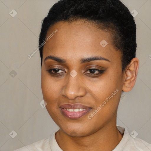 Joyful black young-adult female with short  black hair and brown eyes