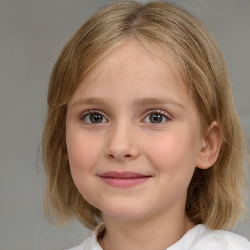 Joyful white child female with medium  brown hair and grey eyes