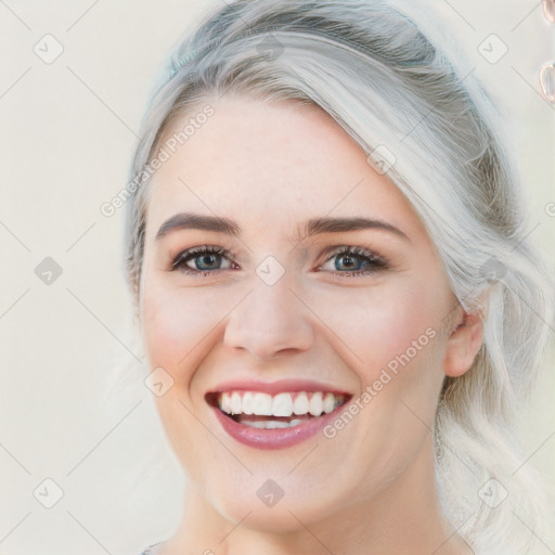 Joyful white young-adult female with medium  brown hair and blue eyes