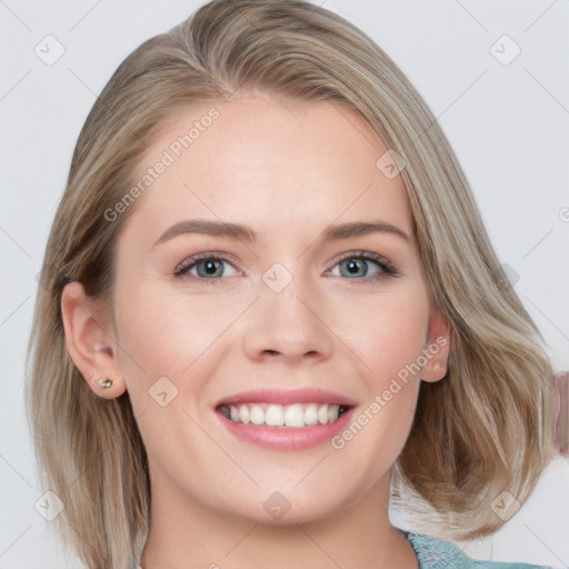 Joyful white young-adult female with medium  brown hair and blue eyes