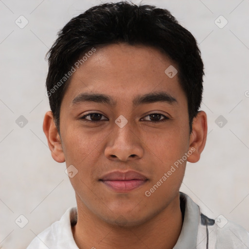 Joyful latino young-adult male with short  brown hair and brown eyes