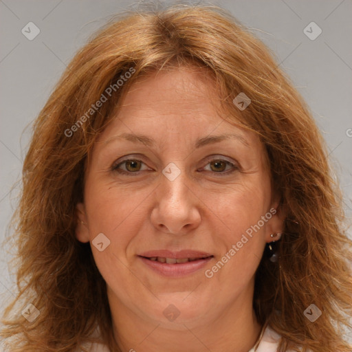 Joyful white adult female with long  brown hair and brown eyes