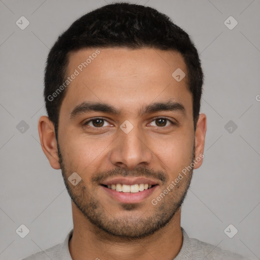 Joyful latino young-adult male with short  brown hair and brown eyes