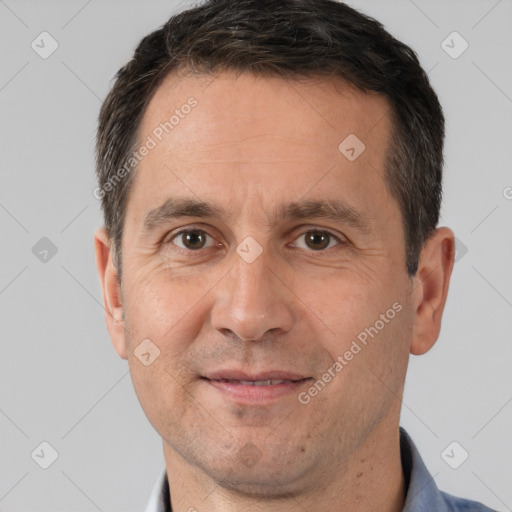 Joyful white adult male with short  brown hair and brown eyes