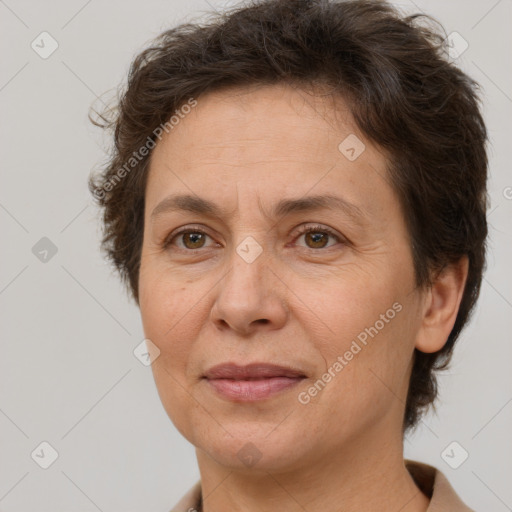 Joyful white adult female with short  brown hair and brown eyes