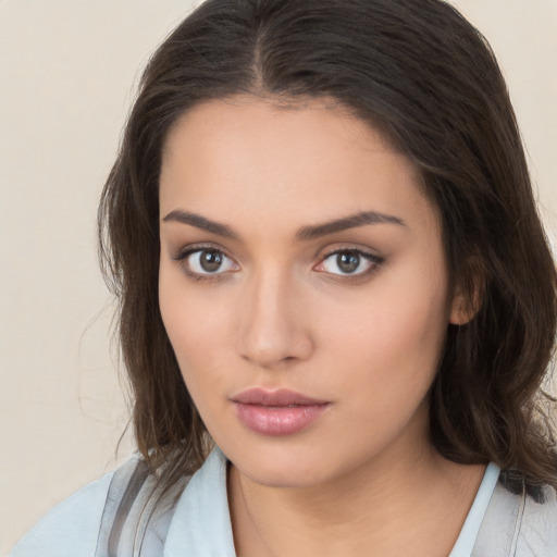 Neutral white young-adult female with medium  brown hair and brown eyes