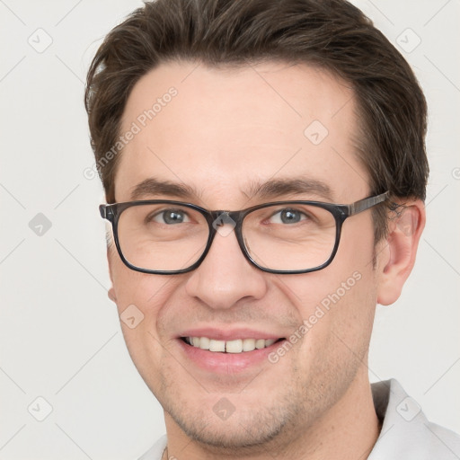 Joyful white adult male with short  brown hair and grey eyes