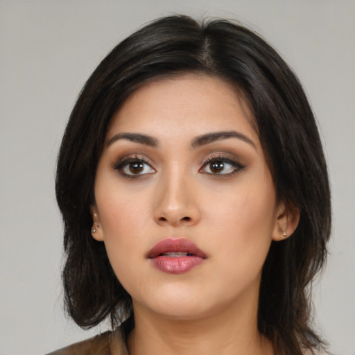 Neutral asian young-adult female with medium  brown hair and brown eyes