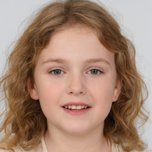 Joyful white child female with medium  brown hair and brown eyes