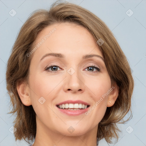 Joyful white adult female with medium  brown hair and grey eyes