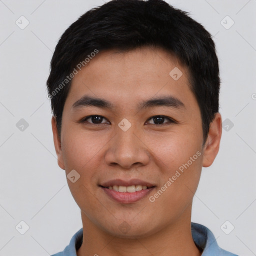 Joyful asian young-adult male with short  brown hair and brown eyes