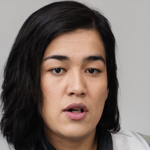 Joyful asian young-adult female with medium  black hair and brown eyes