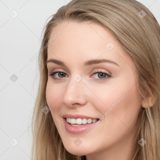 Joyful white young-adult female with long  brown hair and blue eyes