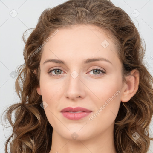 Joyful white young-adult female with long  brown hair and green eyes