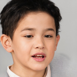 Joyful white child male with short  brown hair and brown eyes