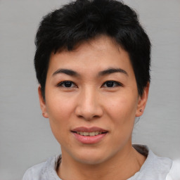 Joyful asian young-adult female with short  black hair and brown eyes