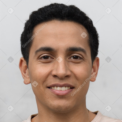 Joyful latino young-adult male with short  brown hair and brown eyes