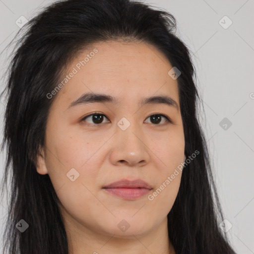 Joyful asian young-adult female with long  brown hair and brown eyes