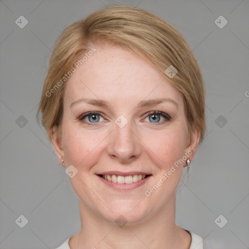 Joyful white adult female with medium  brown hair and blue eyes