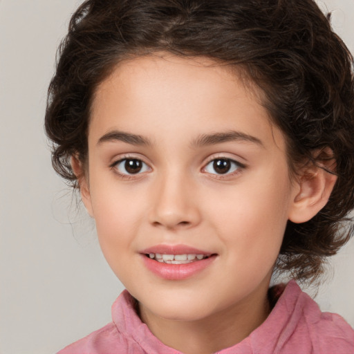 Joyful white child female with medium  brown hair and brown eyes