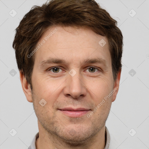 Joyful white adult male with short  brown hair and grey eyes