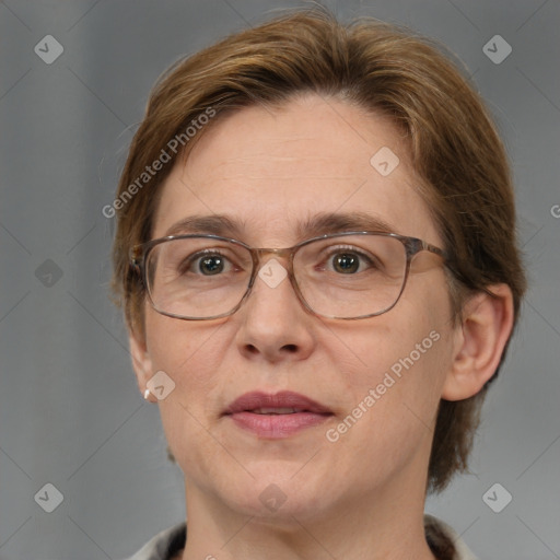 Joyful white adult female with medium  brown hair and blue eyes