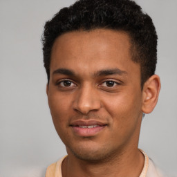 Joyful black young-adult male with short  brown hair and brown eyes