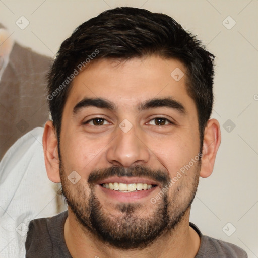 Joyful white young-adult male with short  black hair and brown eyes