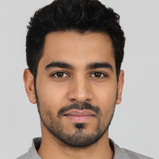 Neutral latino young-adult male with short  black hair and brown eyes