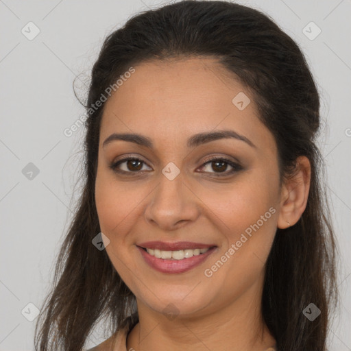 Joyful white young-adult female with long  brown hair and brown eyes