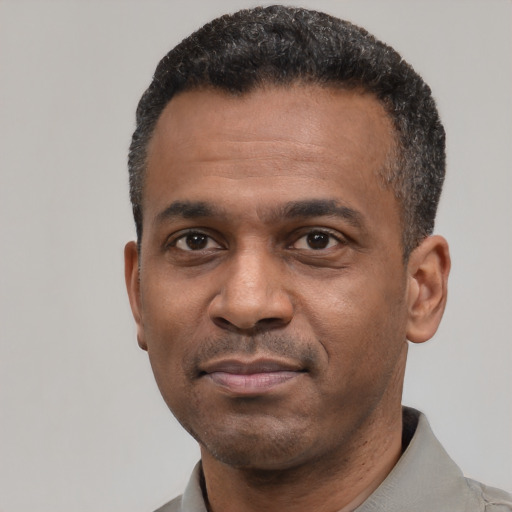 Neutral latino adult male with short  black hair and brown eyes
