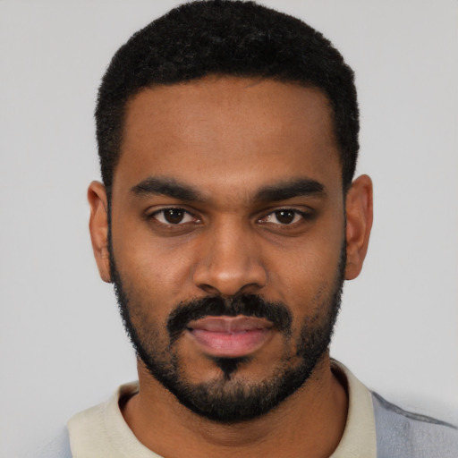 Neutral black young-adult male with short  black hair and brown eyes
