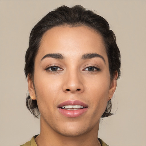 Joyful white young-adult female with medium  brown hair and brown eyes