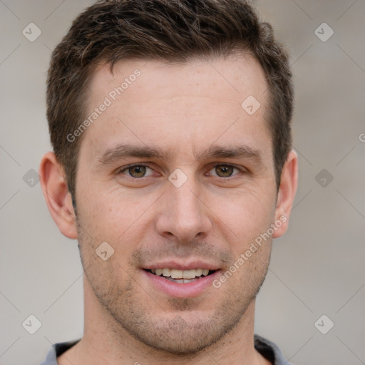 Joyful white young-adult male with short  brown hair and grey eyes