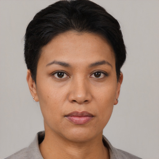 Neutral latino young-adult female with short  black hair and brown eyes