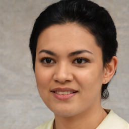 Joyful asian young-adult female with short  brown hair and brown eyes