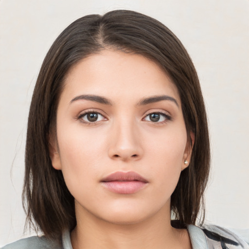 Neutral white young-adult female with medium  brown hair and brown eyes