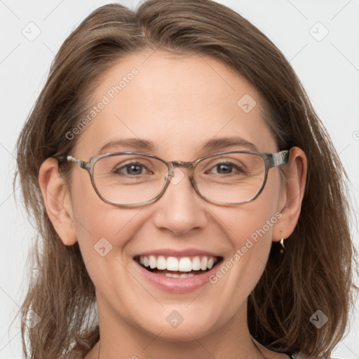 Joyful white adult female with medium  brown hair and blue eyes