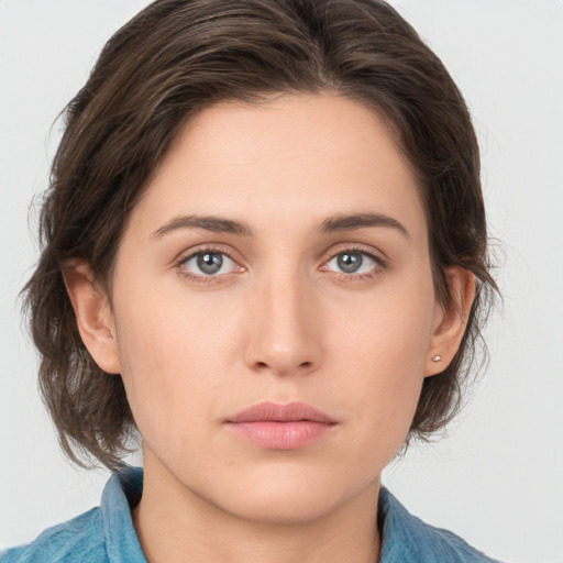 Neutral white young-adult female with medium  brown hair and grey eyes