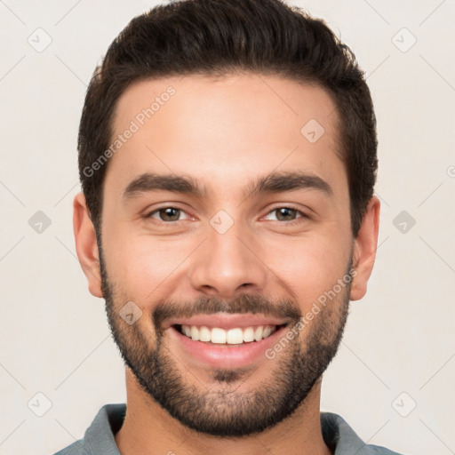 Joyful white young-adult male with short  brown hair and brown eyes