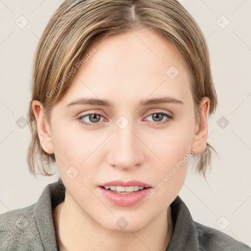 Joyful white young-adult female with medium  brown hair and blue eyes