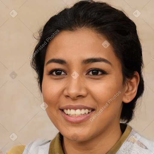 Joyful latino young-adult female with medium  brown hair and brown eyes