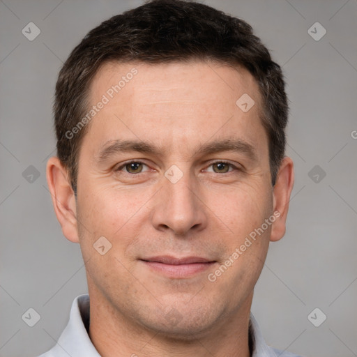 Joyful white adult male with short  brown hair and brown eyes